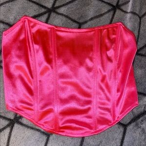 Pink strapless corset top.